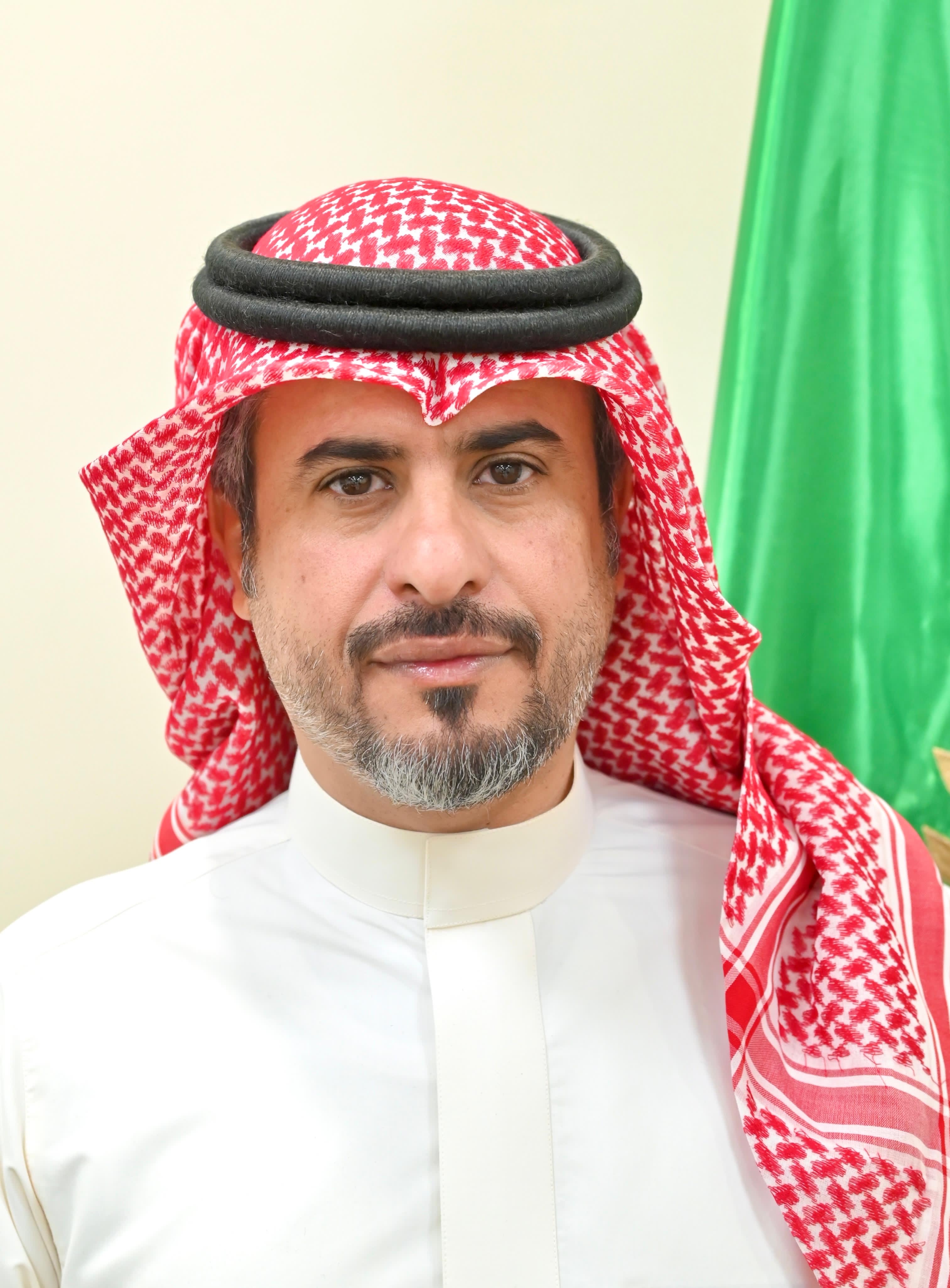 Orhan Abbas wearing a head scarf